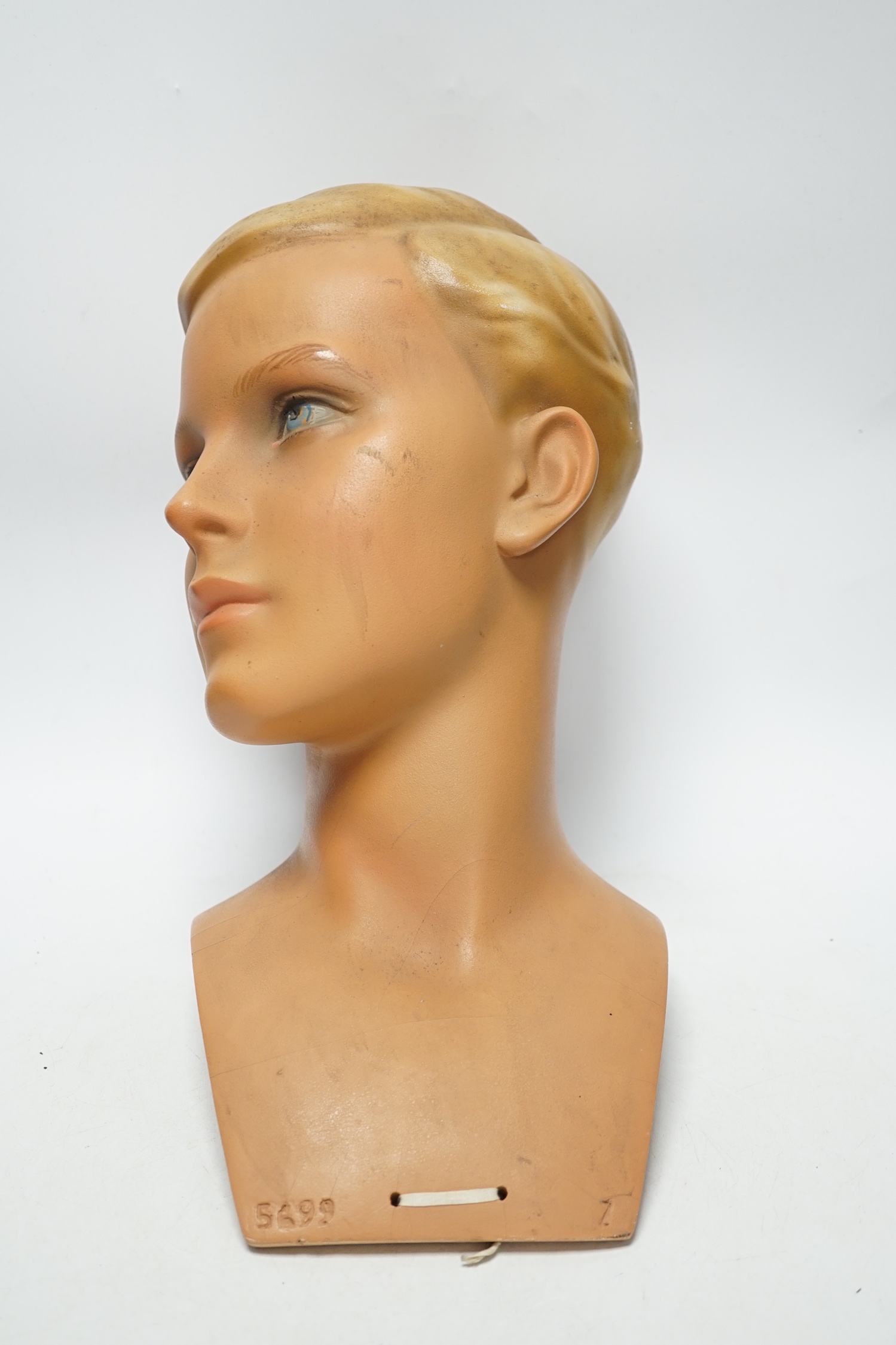 An Imans, Paris, plaster mannequin shop display head of a boy, 30cm high